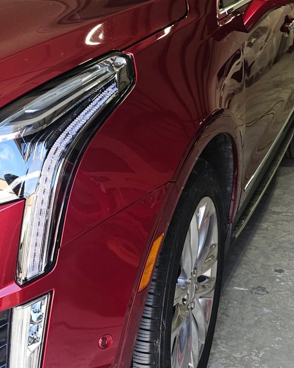 After: red SUV front fender, repaired