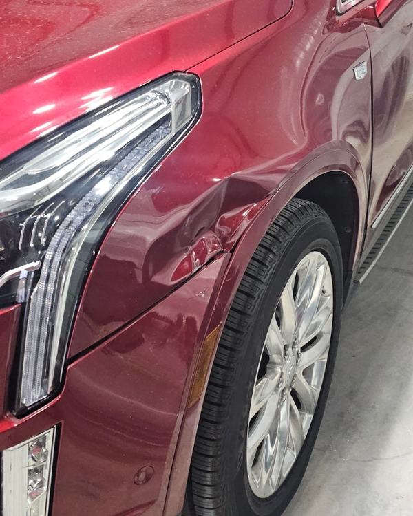 Before: red SUV front fender